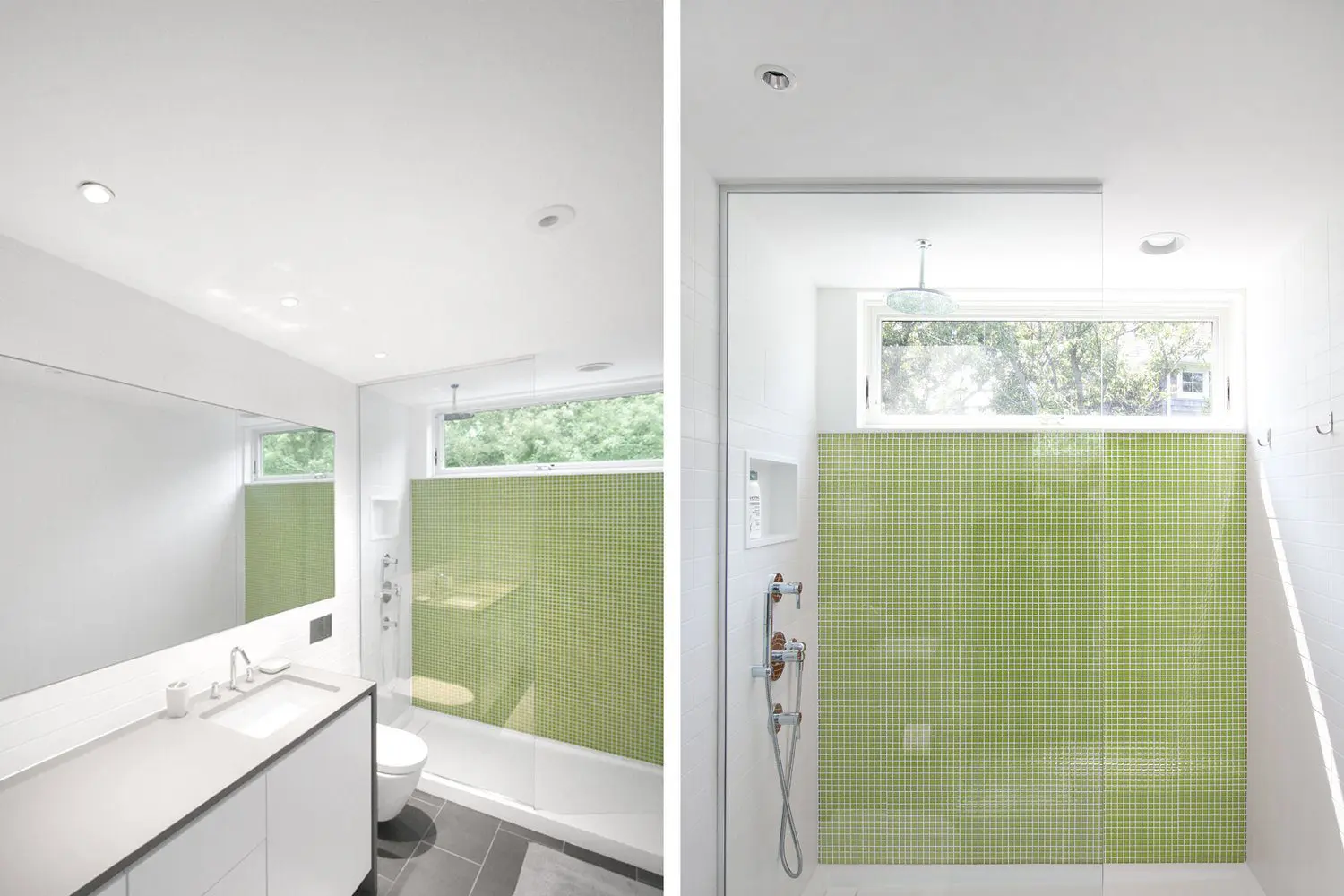 Modern bathroom with green tiled shower and large window.