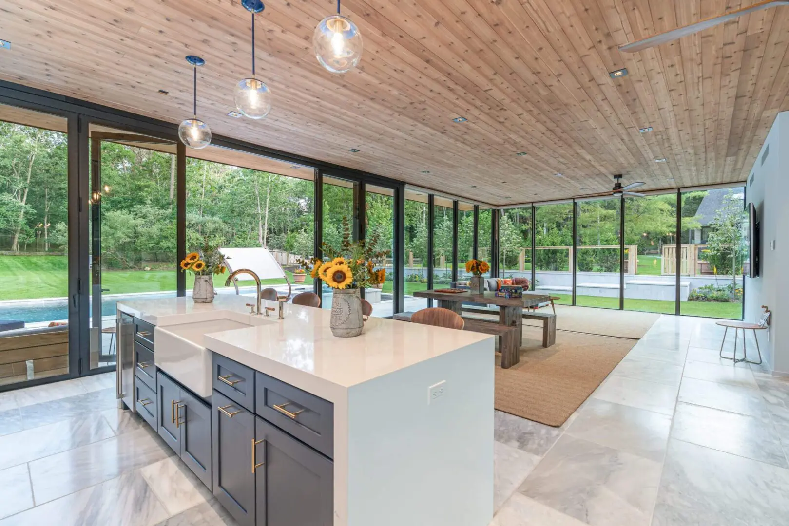 Island kitchen with farmhouse sink and sunflowers