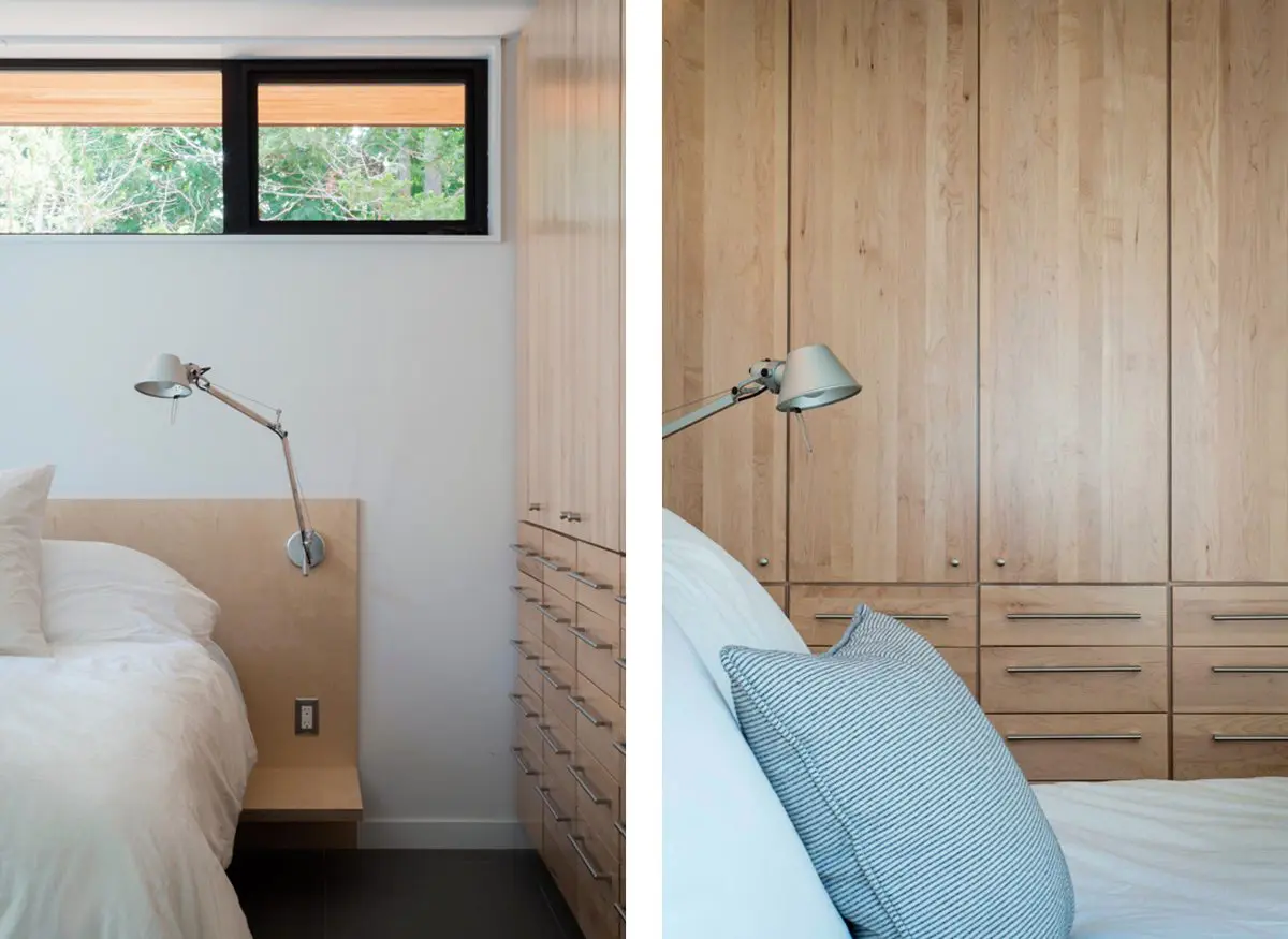 Minimalist bedroom with wooden bedside tables and soft natural light.