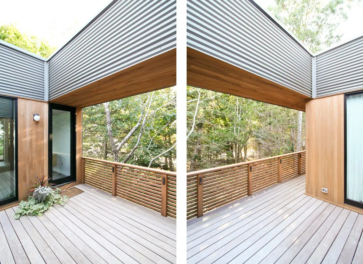 Modern wooden deck with metal railing and a stylish overhang ceiling.