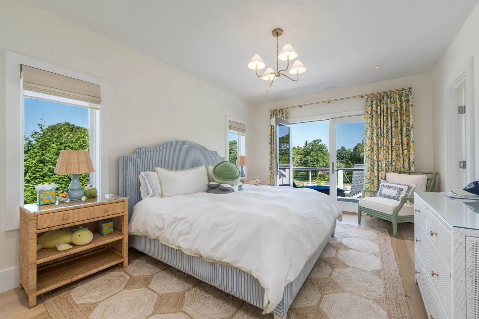 Bright bedroom with a large bed and garden view.