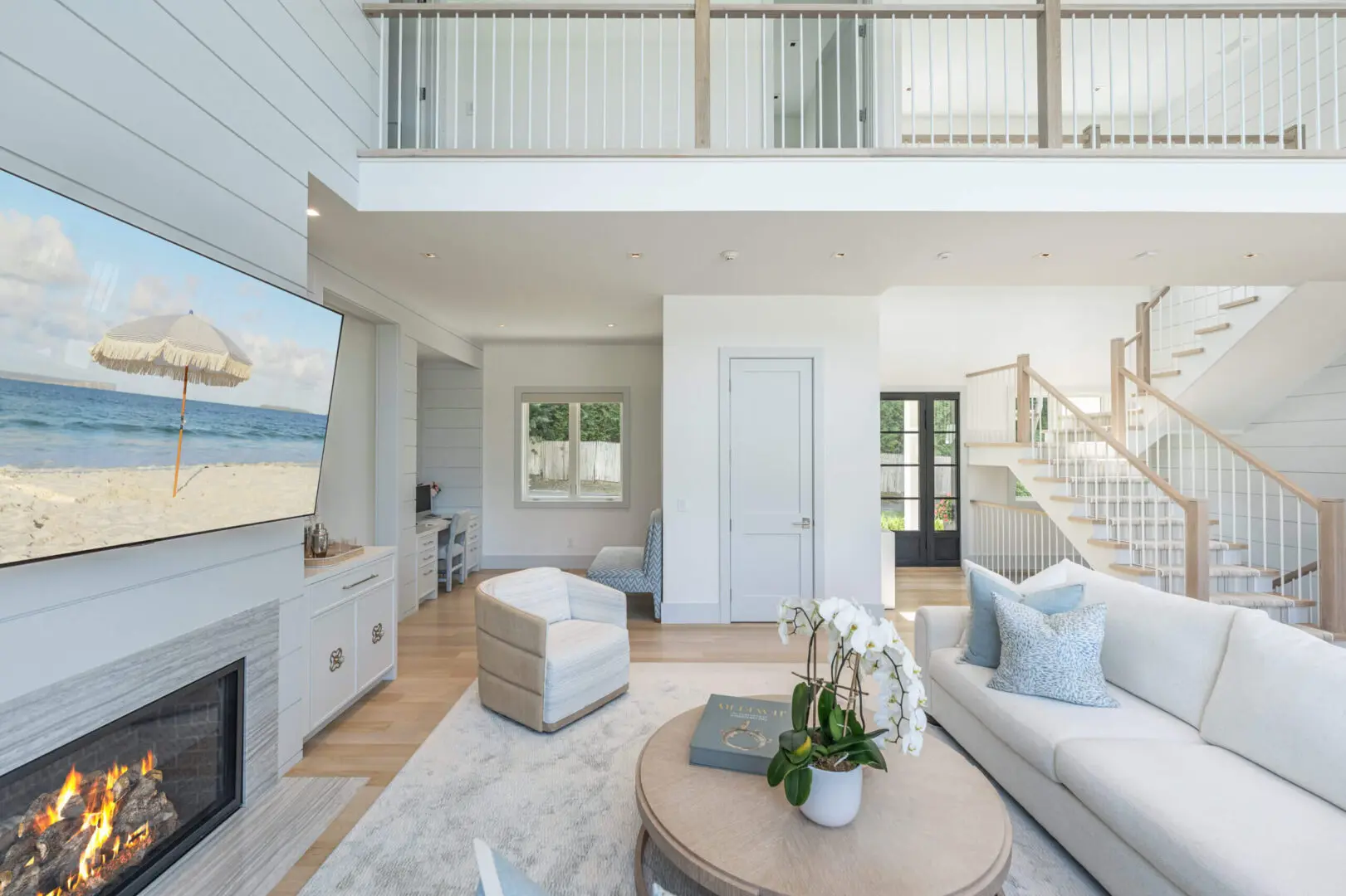 Bright and airy modern living room with neutral tones and coastal decor.